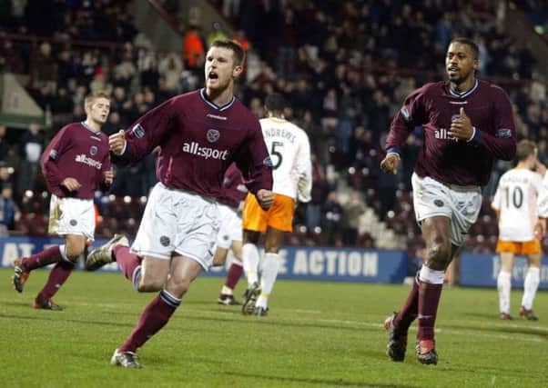 Hearts striker Andy Kirk wheels away in delight after scoring his side's second goal from the spot