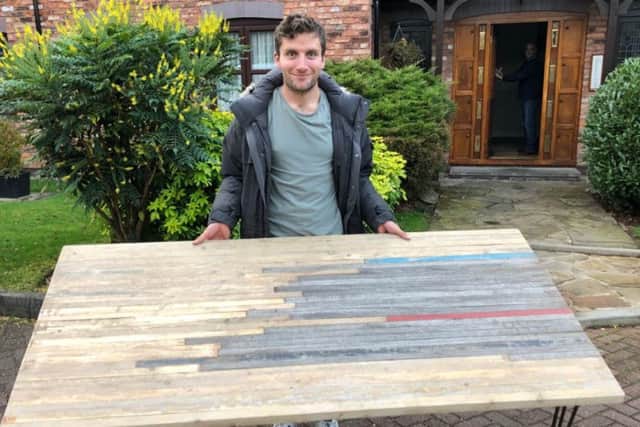 Callum Skinner with the table made from the old velodrome. Picture: Twitter