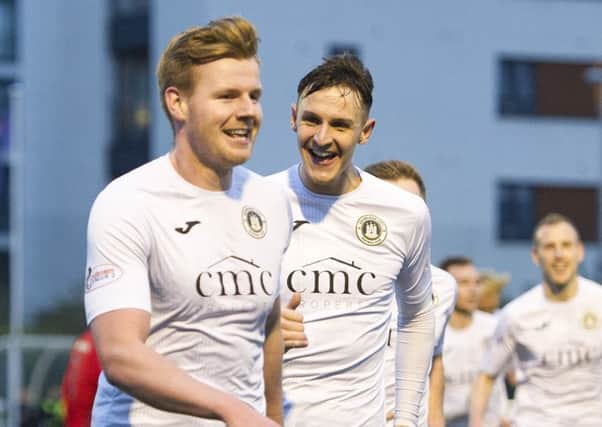 Blair Henderson, left, celebrates with Liam Henderson after scoring the first goal. Pics: Ian Rutherfords