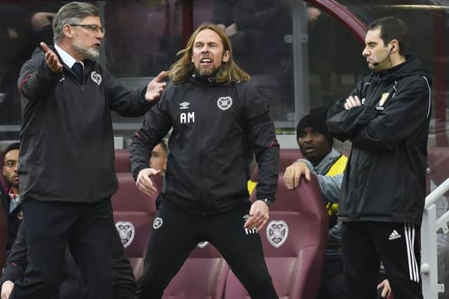 Craig Levein and Austin MacPhee remonstrate with the fourth official