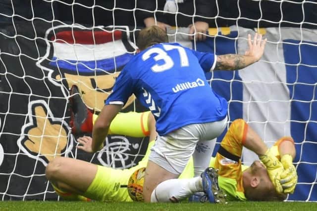 Rangers midfielder Scott Arfield collided with the Hearts keeper Zdenek Zlamal during Sundays fiery encounter at Tynecastle. Pic: SNS