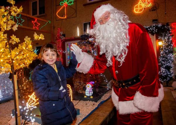 The grotto of Santa Davie Brown of Bonnyrigg who has been lighting up the town for over 10 years. Pic: P1 pupil Brook Louden from local Hawthornden Primary