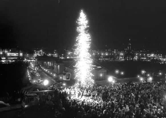 Crowds gather at The Mound in Edinburgh to watch the lights of the Norwegian Christmas tree being switched on.