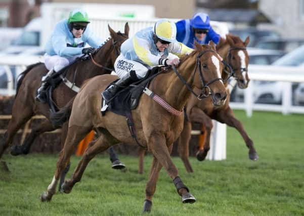 Smart Ruler (centre) competing in the Neville Porter - Musselburgh's No1 Bookmaker Handicap Hurdle Race.