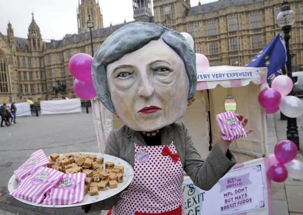 Campaigners mock Theresa Mays Brexit fudge. Picture: AP