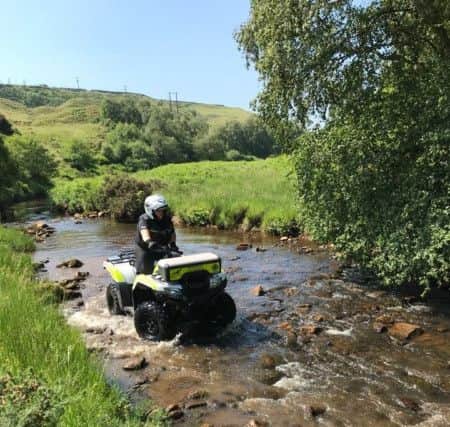 An officer using an off-road vehicle