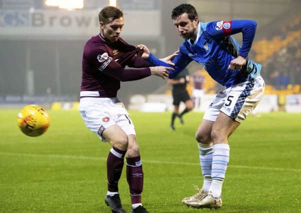 Craig Wigton gets to grips with St Johnstone captain Joe Shaughnessy. Pic: SNS