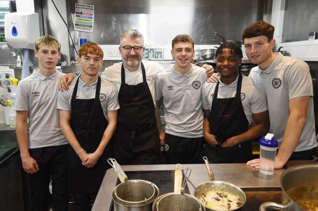 Hearts youth players Scott McGill, Sean Ward, Mackenzie Lawler, Leeroy Makovora and Dino Leddie learn some cooking skills at the Witchery from chef Doug Roberts. Pic: Greg Macvean
