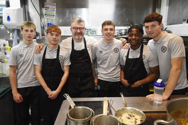 Hearts youth players Scott McGill, Sean Ward, Mackenzie Lawler, Leeroy Makovora and Dino Leddie learn some cooking skills at the Witchery from chef Doug Roberts. Pic: Greg Macvean