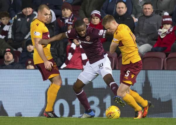 Arnaud Djoum (centre) was a stand-out performer for Hearts. Picture: SNS Group