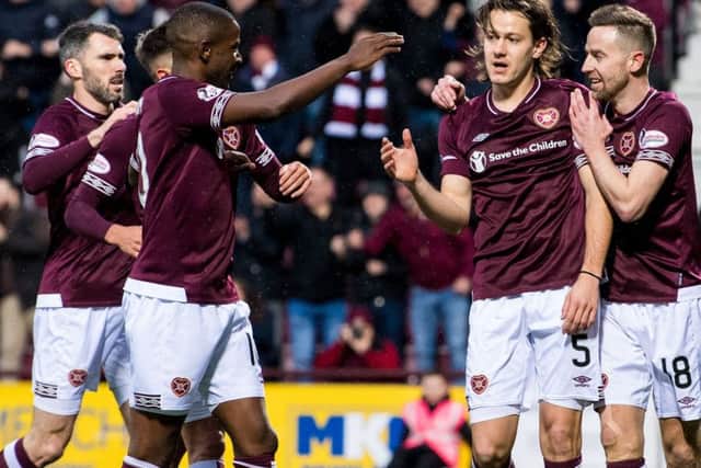 Michael Smith, far left, joins in the celebrations after Peter Haring put Hearts ahead against Motherwell. Pic: SNS