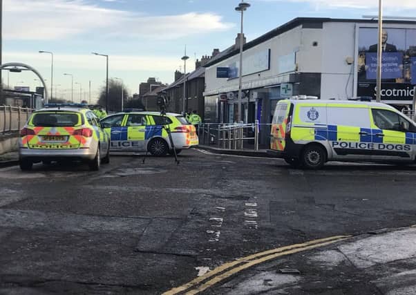 Officers set up a cordon at Calder Road this morning