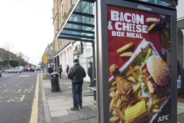 A KFC advert on an Edinburgh bus stop.