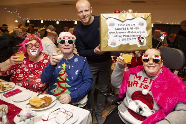 Hearts forward Steven Naismith was on hand for the Loaves and Fishes Christmas charity lunch, which he again funded for homeless people in Glasgow. Pic: SNS