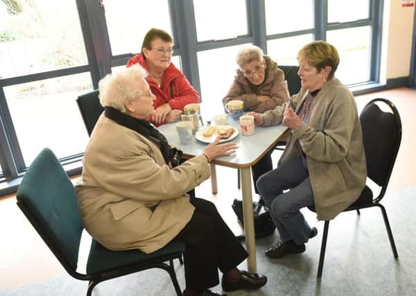 Sharing a cup of tea at the Drylaw Neighbourhood Centre, which is losing Â£43,000 of funding. Picture: Greg Macvean