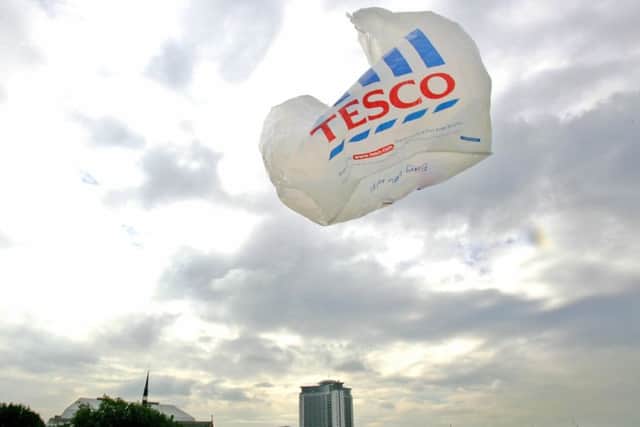 A Tesco  plastic bag blows in the wind on a supermarket parking lot. Pic: Odd Andersen/AFP/Getty Images