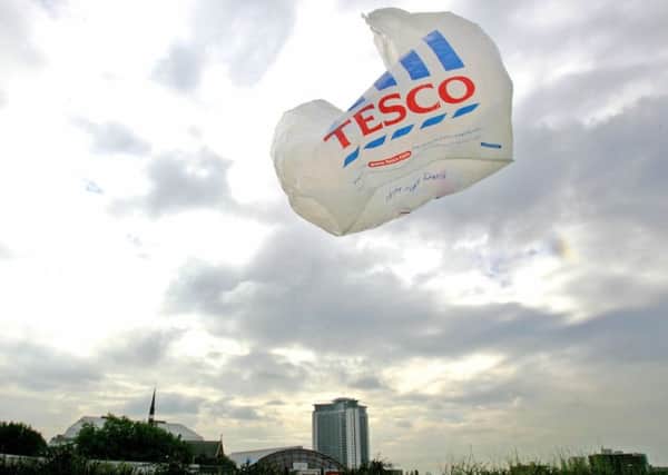 A Tesco  plastic bag blows in the wind on a supermarket parking lot. Pic: Odd Andersen/AFP/Getty Images