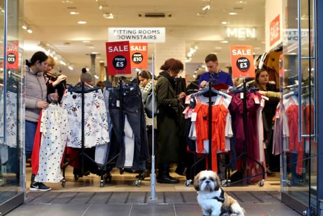 Shoppers seek a bargain in Edinburgh on Boxing Day  but high street retails future is unclear. Picture: PA