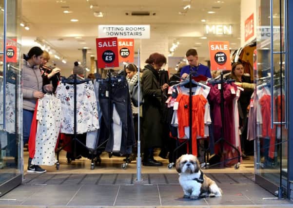 Shoppers seek a bargain in Edinburgh on Boxing Day  but high street retails future is unclear. Picture: PA