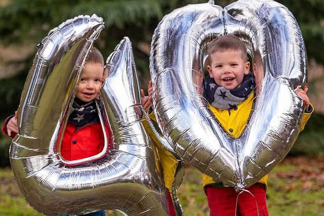 Twins Finlay (left) and Hamish (right) Taylor, age 2.5, celebrate the 40th anniversary of the Edinburgh & Lothians Twins & Multiples Club