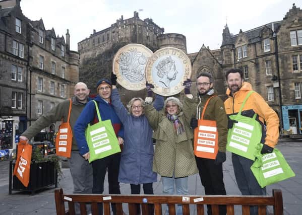 Updated research shows that Christmas shoppers who walk to high streets could be spending more than those who drive there.  Left to right - Henry Northmore (Sustrans), Stuart Hay (Living Streets Edinburgh), Isobel Leckie (Living Streets Edinburgh), Morag Jones (Living Streets Edinburgh), David Kernohan (Transport Scotland), Lindley Kirkpatrick (Sustrans).