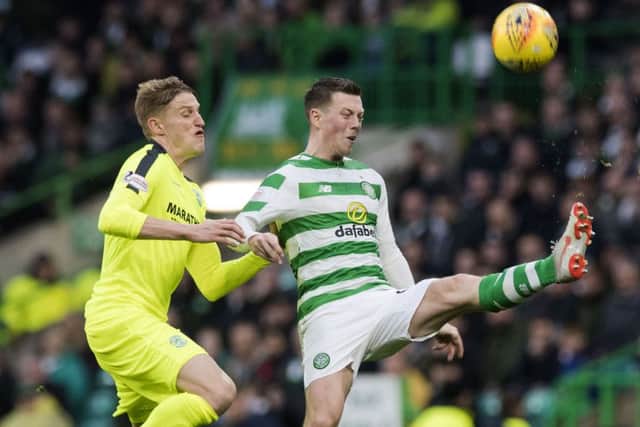 Hibs midfielder Vykintas Slivka battles it out with Callum McGregor during the last meeting between the sides. Picture: SNS