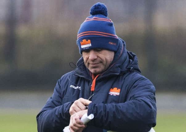 Edinburgh Rugby head coach Richard Cockerill checks his watch in training for the Newcastle game