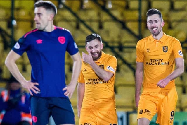Olly Lee looks elsewhere as Livingston celebrate another goal. Picture: SNS Group
