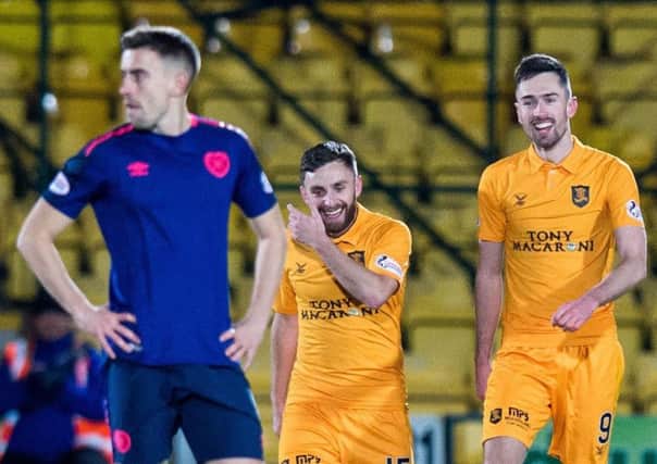 Olly Lee looks elsewhere as Livingston celebrate another goal. Picture: SNS Group