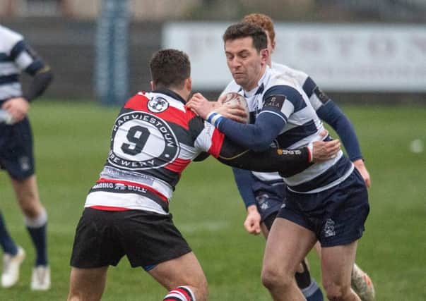 Peter Jerecivich of Heriot's, right, takes on Stirling's Charlie Simpson