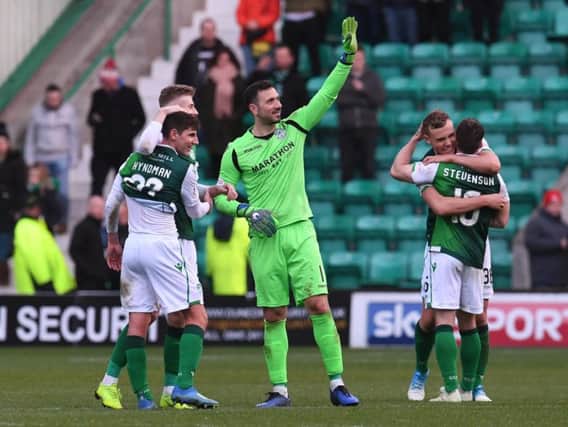 Hibs players celebrate their victory over Celtic.