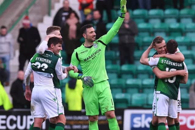 Ofir Marciano acknowledges the fans as his team-mates celebrate defeating Celtic 2-0
