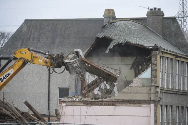 St John's Primary School on Duddingston Road is demolished by a digger. Picture: Greg Macvean