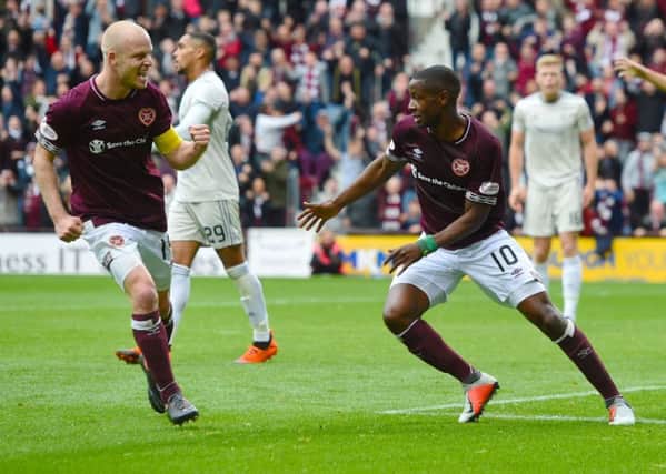 Steven Naismith, left, celebrates with Arnaud Djoum after the Cameroonian opened the scoring against Aberdeen in the 2-1 victory at Tynecastle in October
