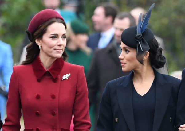 Kate, Duchess of Cambridge (L) talks to Meghan, Duchess of Sussex as they arrive for the Royal Family's traditional Christmas Day service at St Mary Magdalene Church in Sandringham, Norfolk. Picture: Paul Ellis/Getty Images