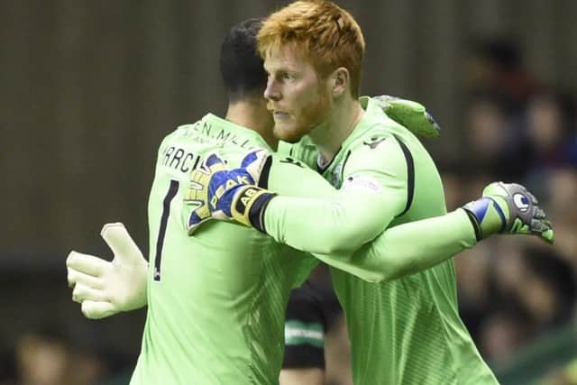 Adam Bogdan, right, consoles, Ofir Marciano, before coming on