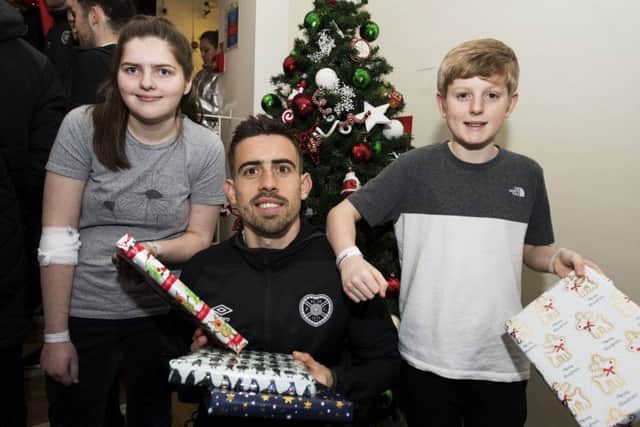 Midfielder Olly Lee met Hannah Sinclair and Dylan Smith when the Hearts squad visited Edinburgh's Royal Hospital for Sick Children