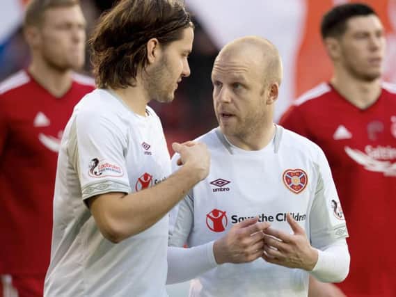Peter Haring and Steven Naismith in discussions during Hearts' defeat to Aberdeen.