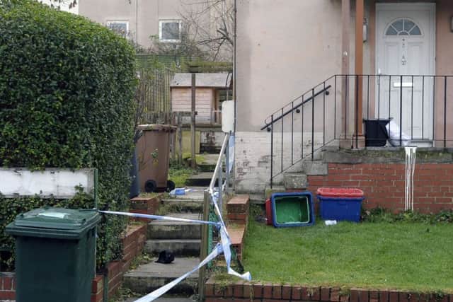 A property has been taped off at Claverhouse Drive. Picture: Neil Hanna