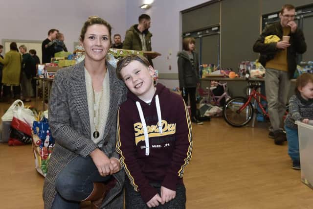 Cole Cowan aged 9 with his mum, Louise Partridge. Cole donated Â£160 of his savings to the appeal.  Picture: Neil Hanna
