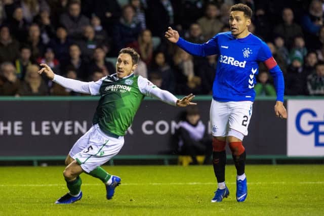Mark Milligan in action with Rangers full-back James Tavernier during the last encounter between the two sides. Picture: SNS