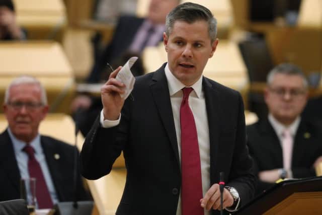 Derek Mackay delivers his draft Budget at the Scottish Parliament
