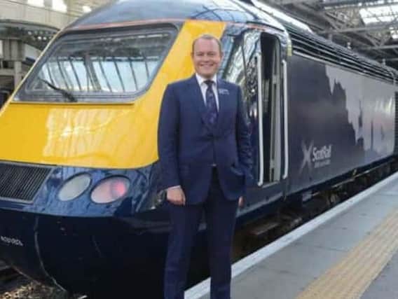 ScotRail Alliance managing director Alex Hynes with its sole refurbished InterCity train delivered so far. Picture: Jon Savage