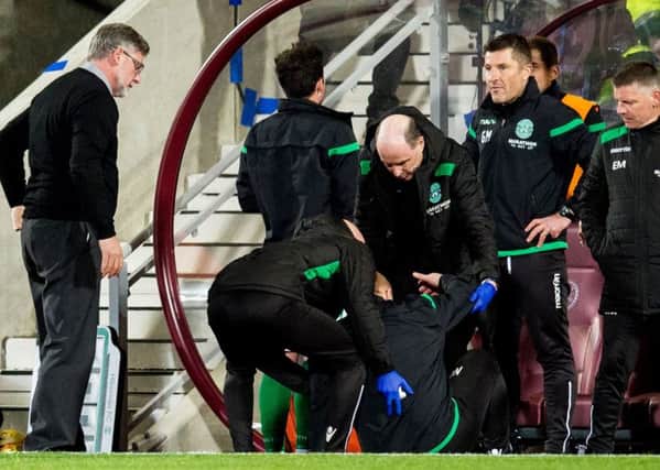 Hibs manager Neil Lennon was hit by a coin at Tynecastle