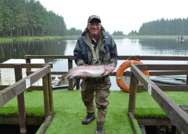 Flashback to the Scierra Pairs heat at Morton Fishings near Livingston last year with Jimmy Rhind from Aberlour proudly displaying the biggest fish on the day, a 9lbs 4oz rainbow trout. Jimmy and his partner Gary Gormley from Dufftown won the heat. Picture: Nigel Duncan Media