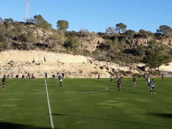 Hearts in action against Sporting Lokeren in Spain