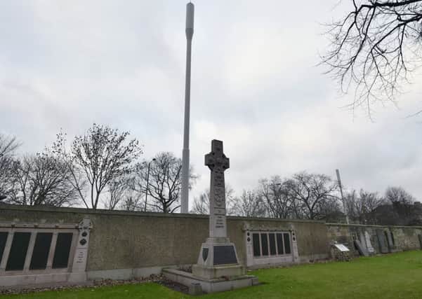 The 17.5 metre mast and component boxes were erected on the pave on Broughton Road, directly in front of an Iona Cross in Rosebank Cemetery.