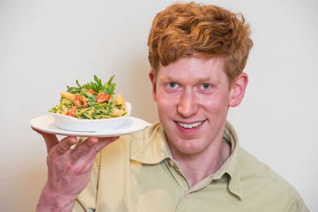 Barrie Henderson taste-testing the Avacado Pasta Salad. Pic: Ian Georgeson