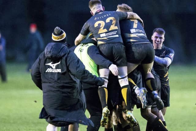 The Currie players celebrate their last minute winning drop goal from Gregor Hunter. Picture: SNS Group/ SRU Bruce White