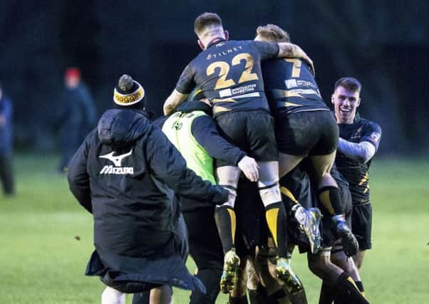 The Currie players celebrate their last minute winning drop goal from Gregor Hunter. Picture: SNS Group/ SRU Bruce White